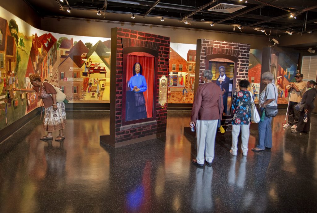 Life-sized 3D characters greet visitors at The African American Museum in PhiladelphiaÕs permanent exhibition, Audacious Freedom Ð African Americans in Philadelphia, 1776-1876. As they speak fervently about their lives, beliefs and aspirations in 18th-century Philadelphia, listeners are immersed in their world. The interactive timeline guides people through 100 years of entrepreneurship, environment, education, religion and family traditions in the African-American community.